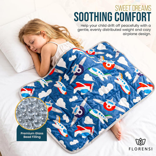 Child asleep under a Florensi weighted lap pad